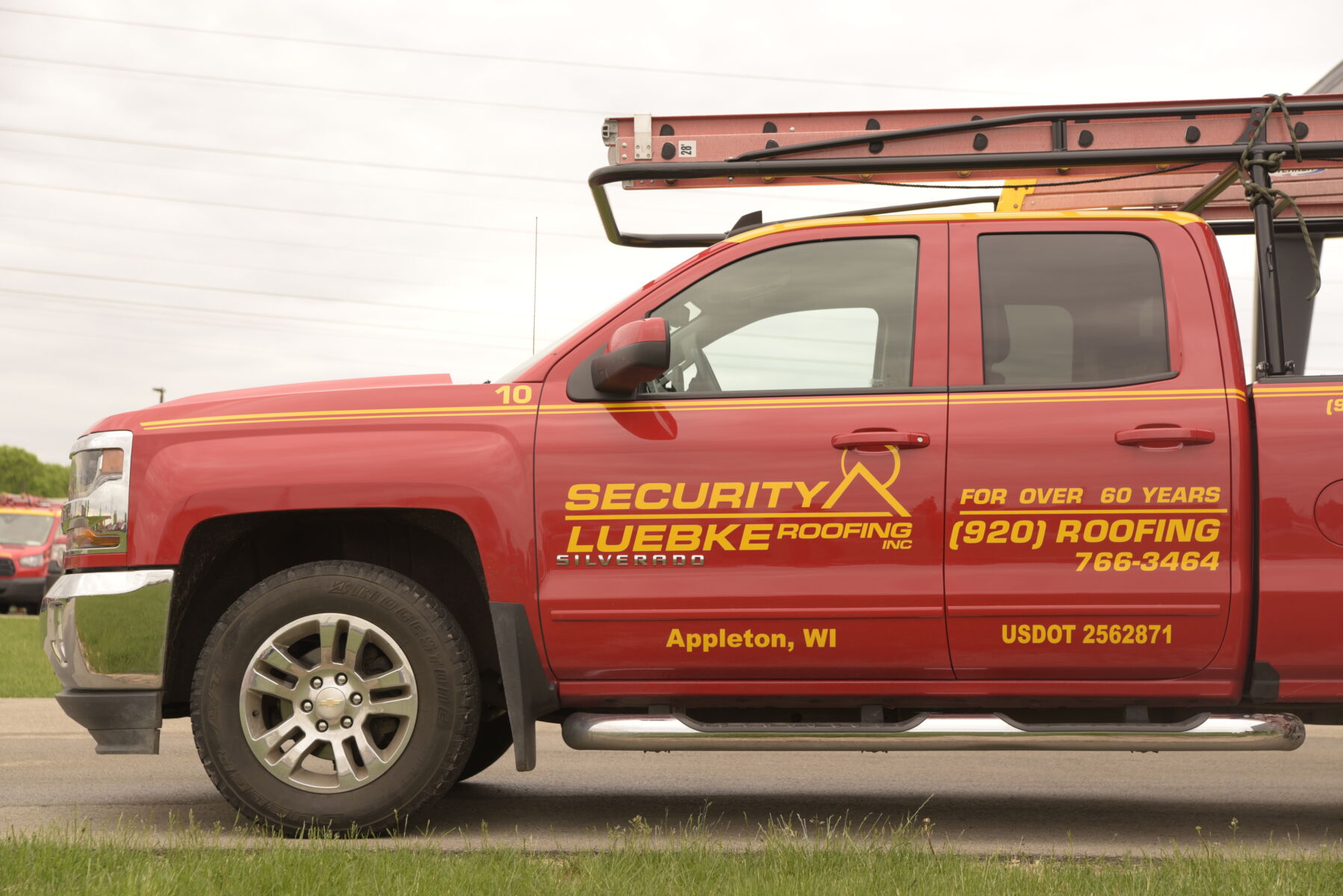 Red Security-Luebke Roofing Truck Recruiting for Trade Careers